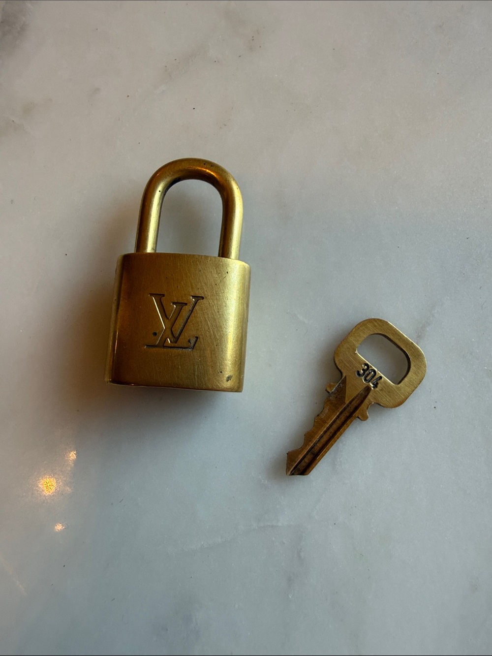 Authentic Louis Vuitton Brass-Tone Padlock and Key Set